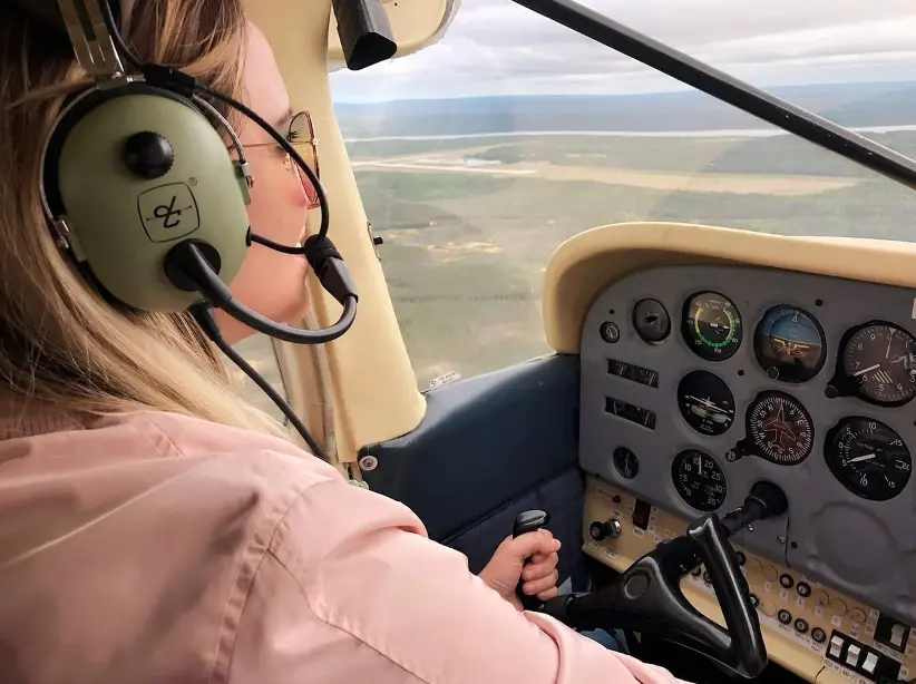 woman pilot flying plane